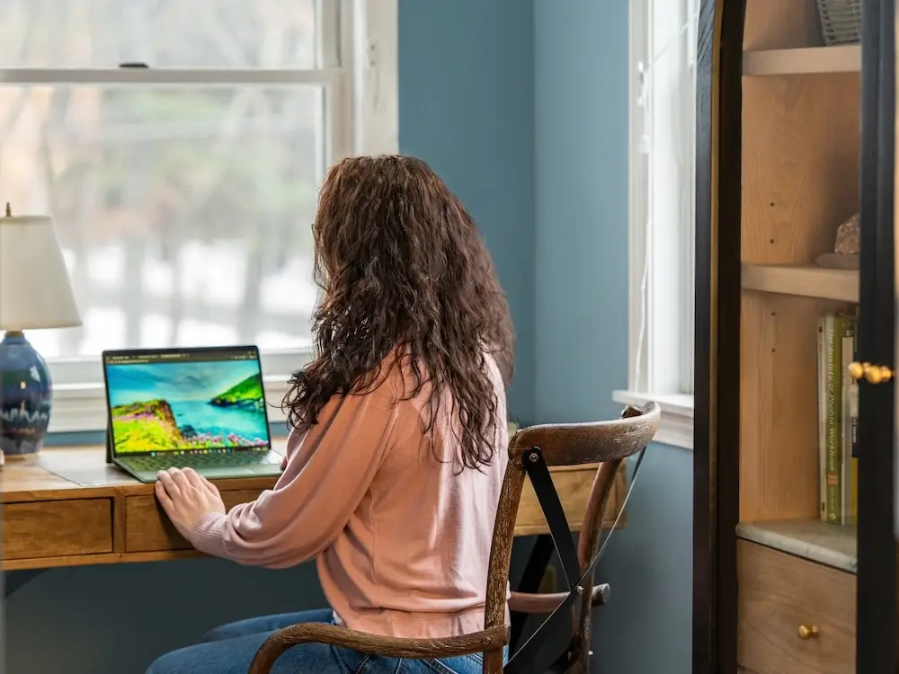 Licensed therapsit Alicia in the office space where Massachusetts licensed mental health therapist provides telehealth sessions.